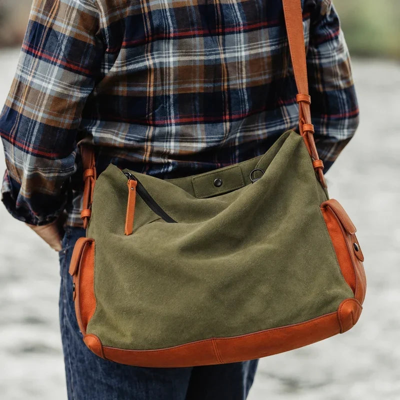 KAKAVY Roam olive suede and orange leather shoulder bag worn with a checked shirt
