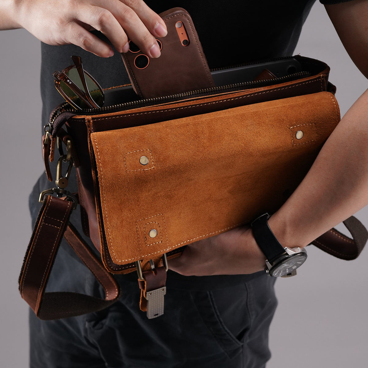 Front storage compartment holding sunglasses and small essentials