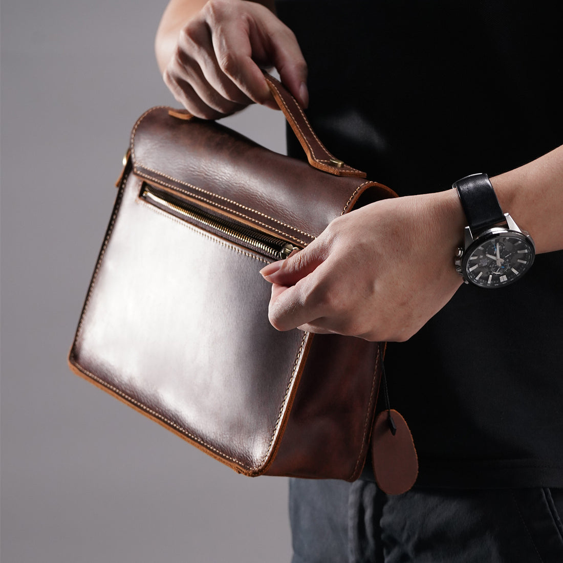 Rear zipper pocket on the brown crazy-horse leather messenger satchel