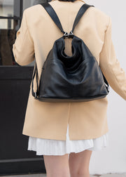 Black convertible top-grain leather tote backpack worn in backpack mode