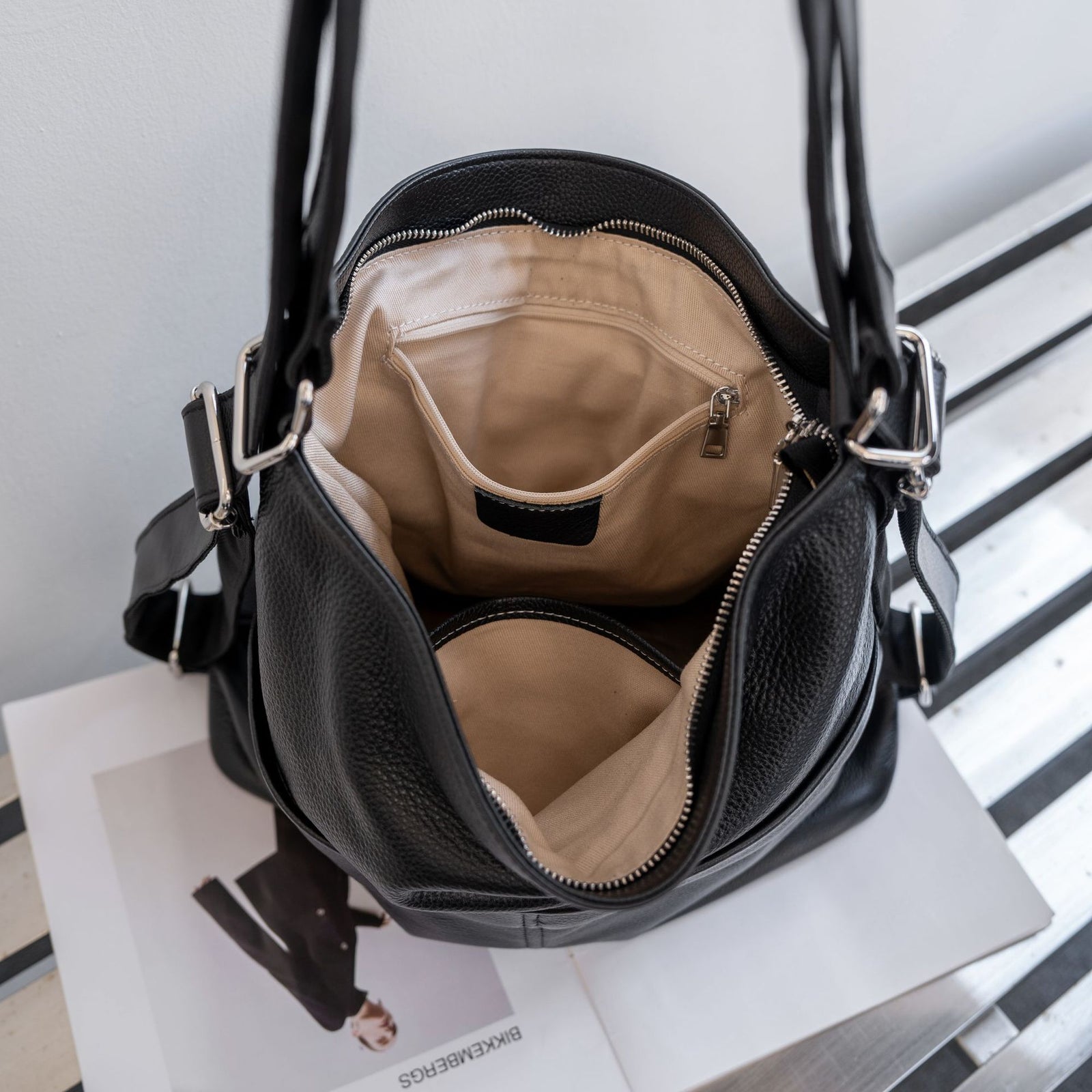 Zippered main compartment with polyester lining, zip pocket and slip pocket
