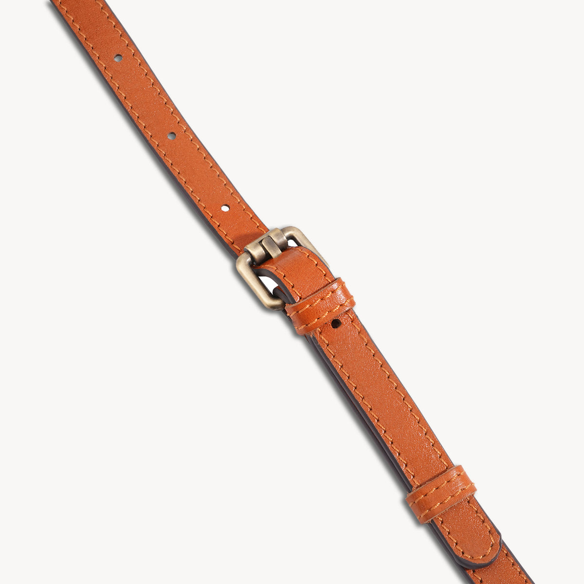 Adjustable leather shoulder strap buckle detail