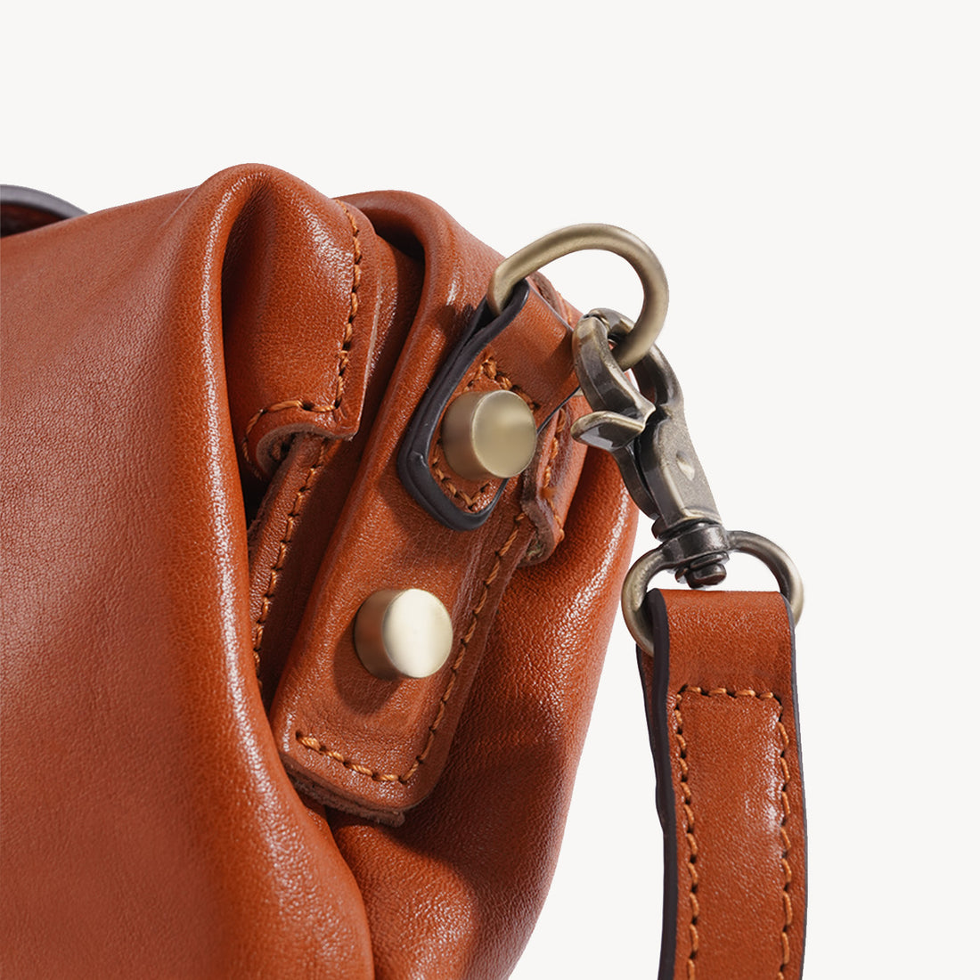 Vegetable-tanned leather grain, stitching and frame construction detail