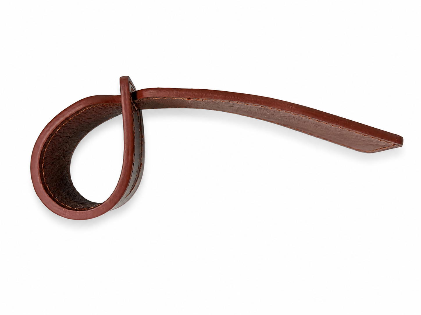 Side view of brown leather luggage tag strap showing flexible loop construction