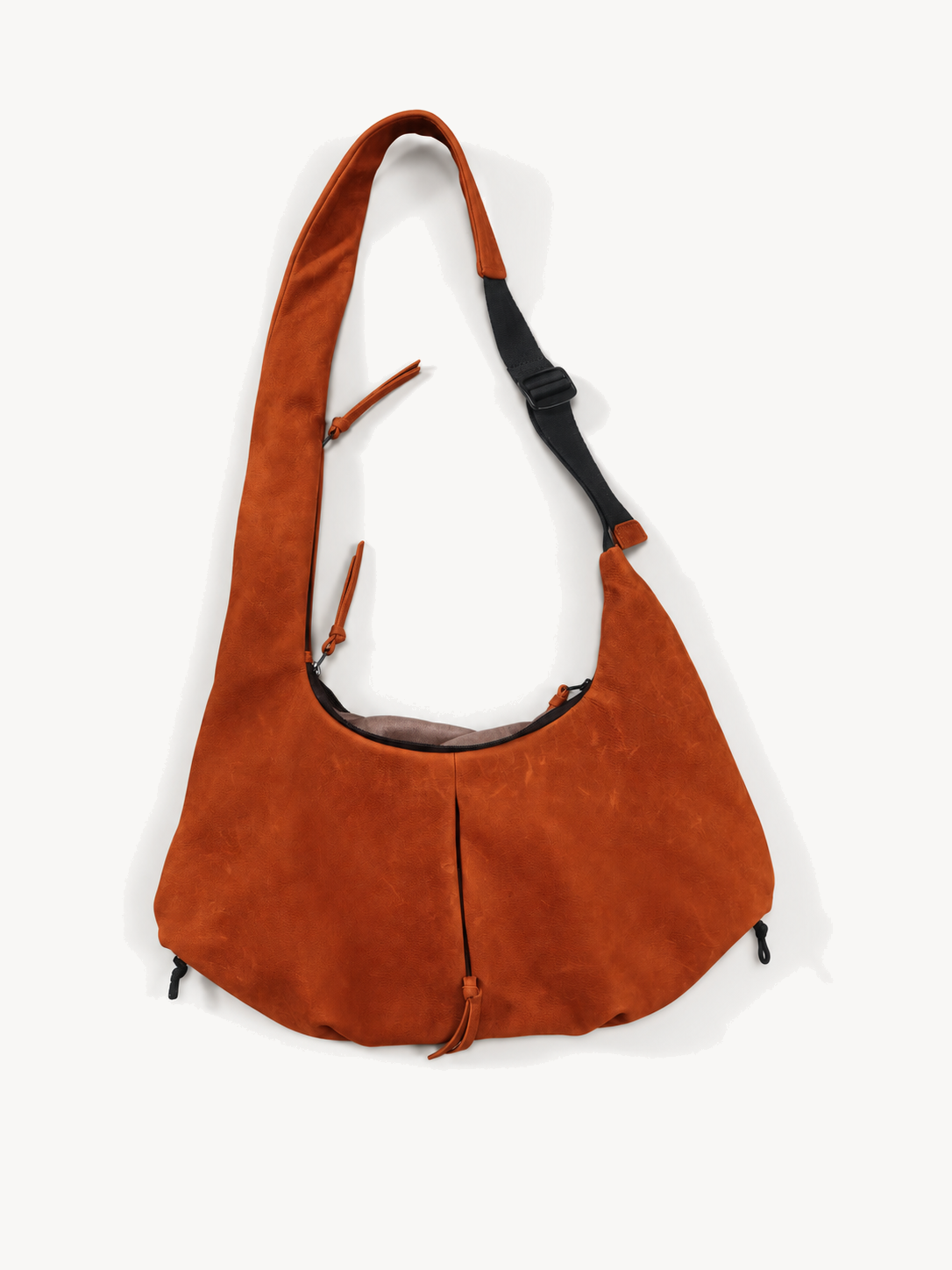 Front product view showing the broad orange cowhide body and adjustable strap