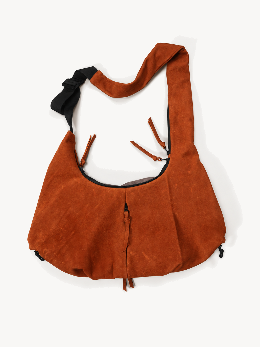 Full layout of the orange cowhide utility crossbody bag and adjustable strap