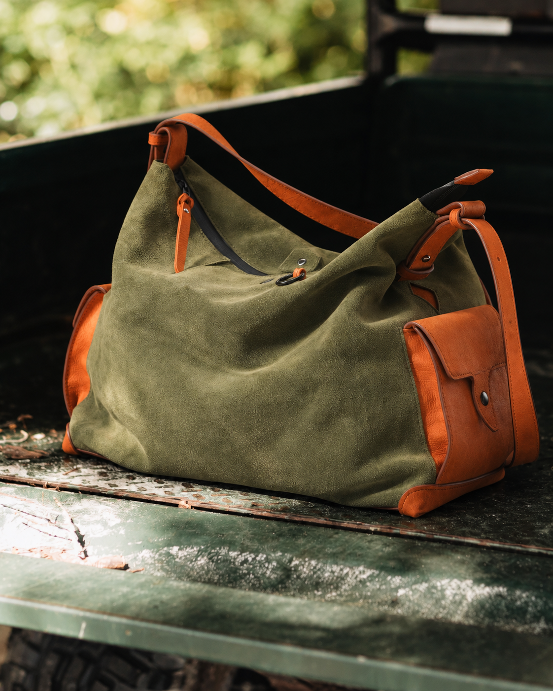 KAKAVY Roam suede and leather shoulder bag in everyday use